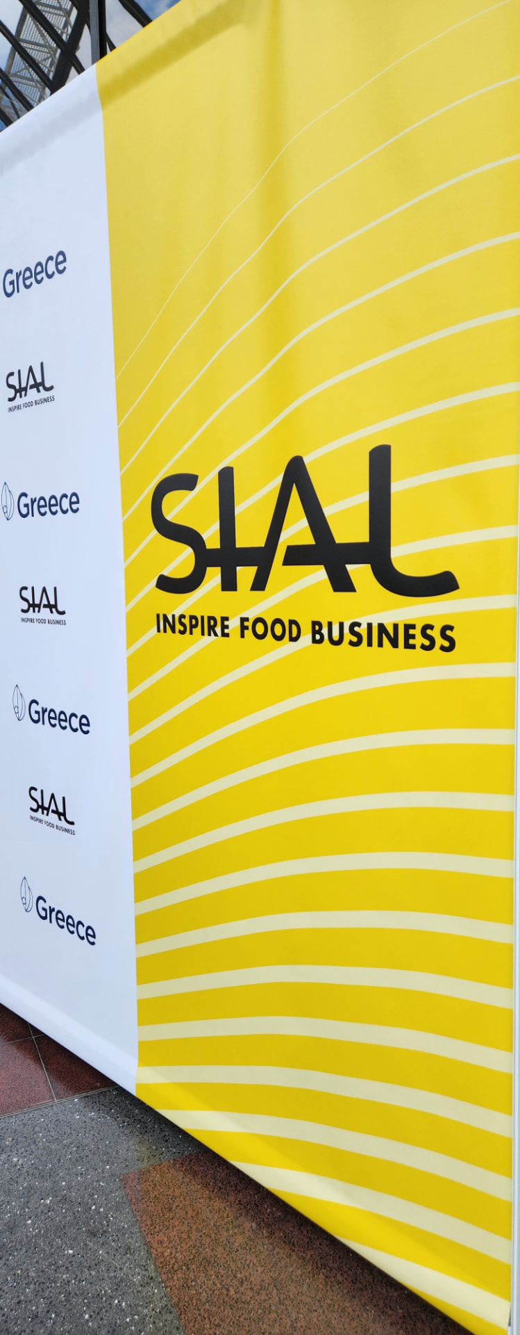 SIAL Inspire Food Business signage beside Greece branding at the exhibition, photographed by theGreex.